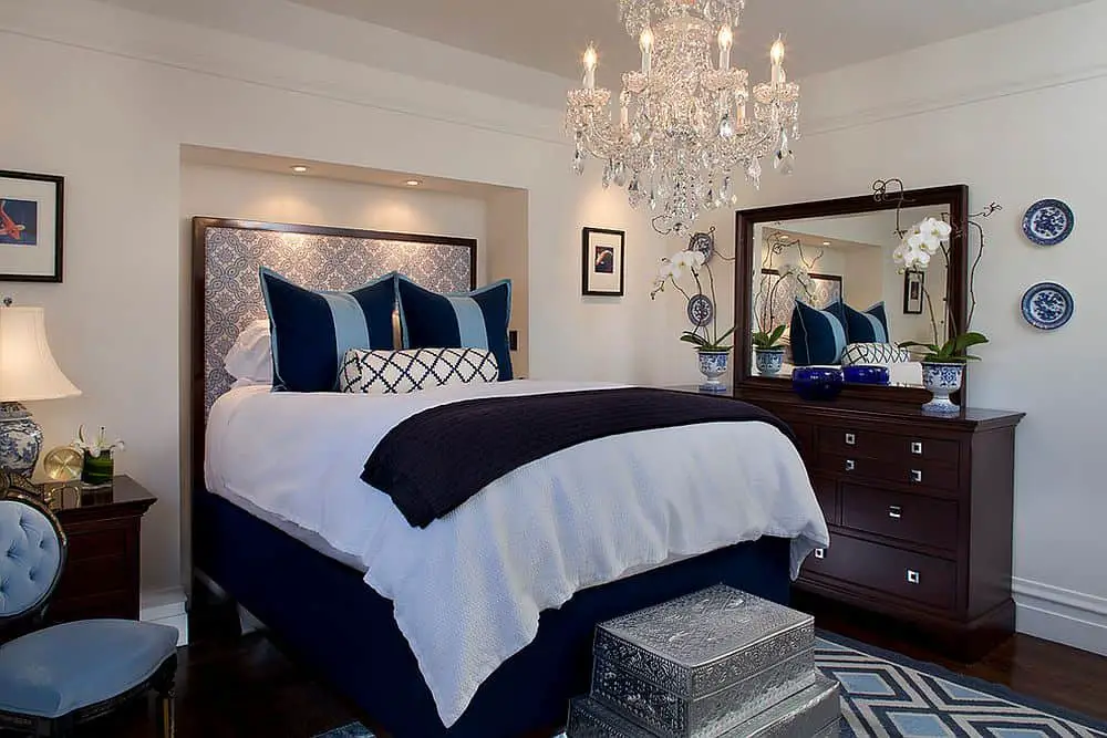 A Modern Bedroom With Beautiful Chandelier