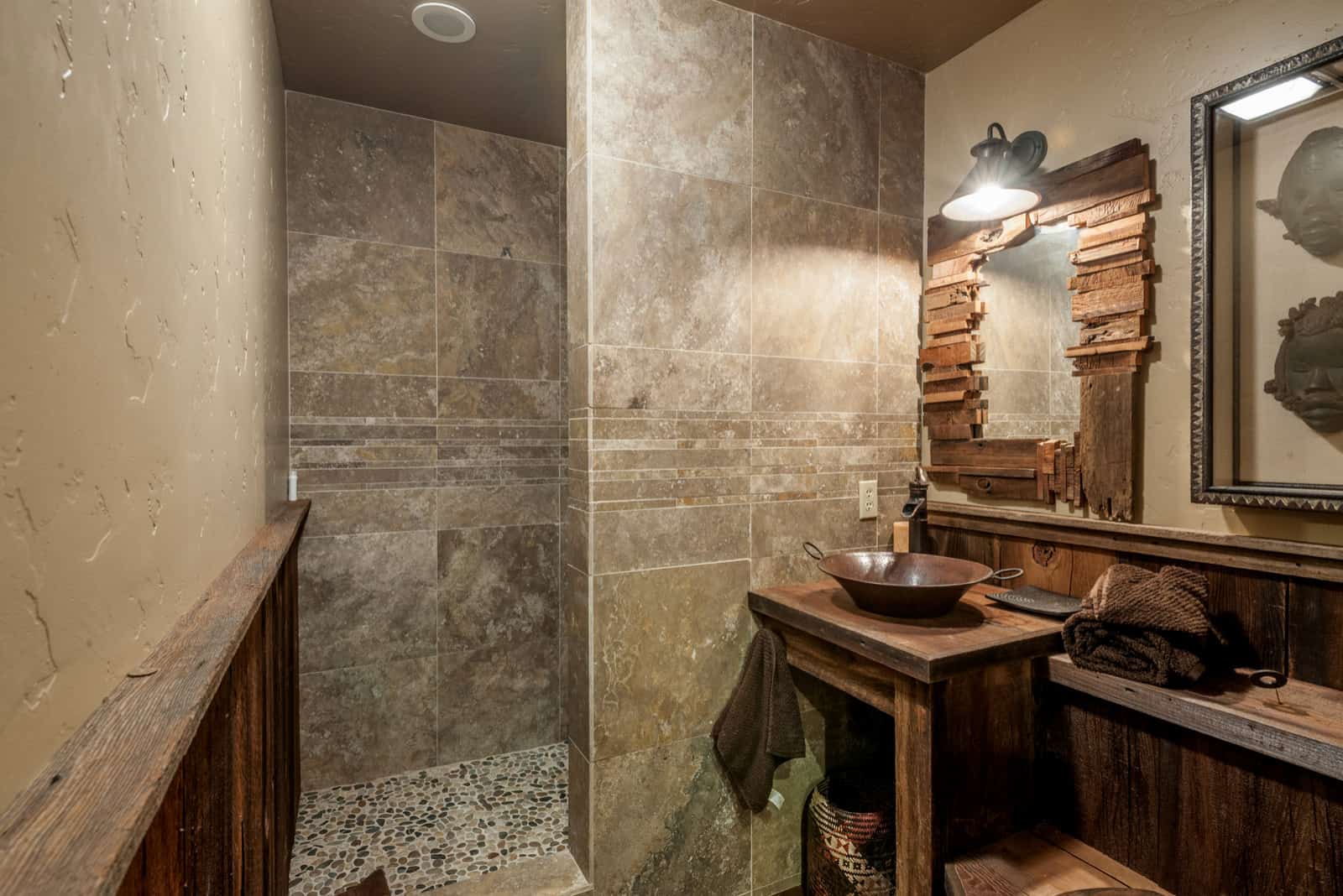 A Rustic Bathroom With A Hunter’s Trophy